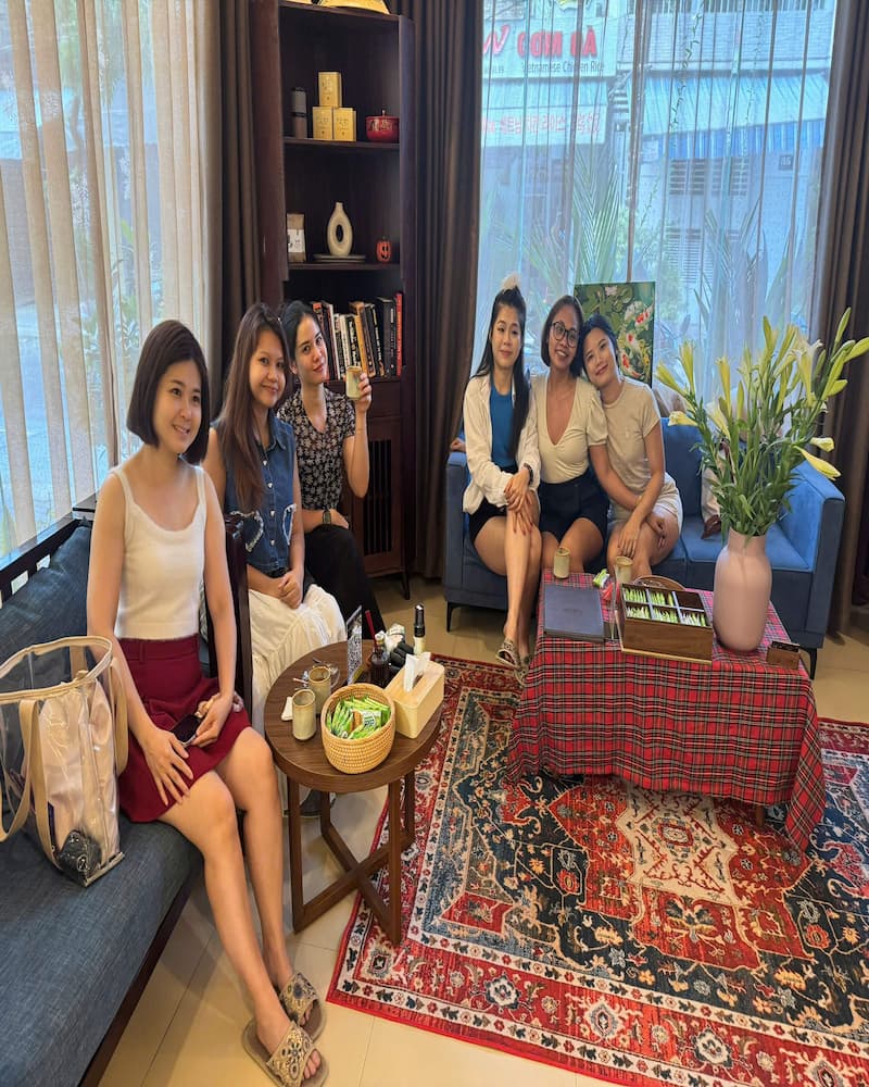 A group of five happy female customers relaxing and enjoying tea at Kiasu Spa.