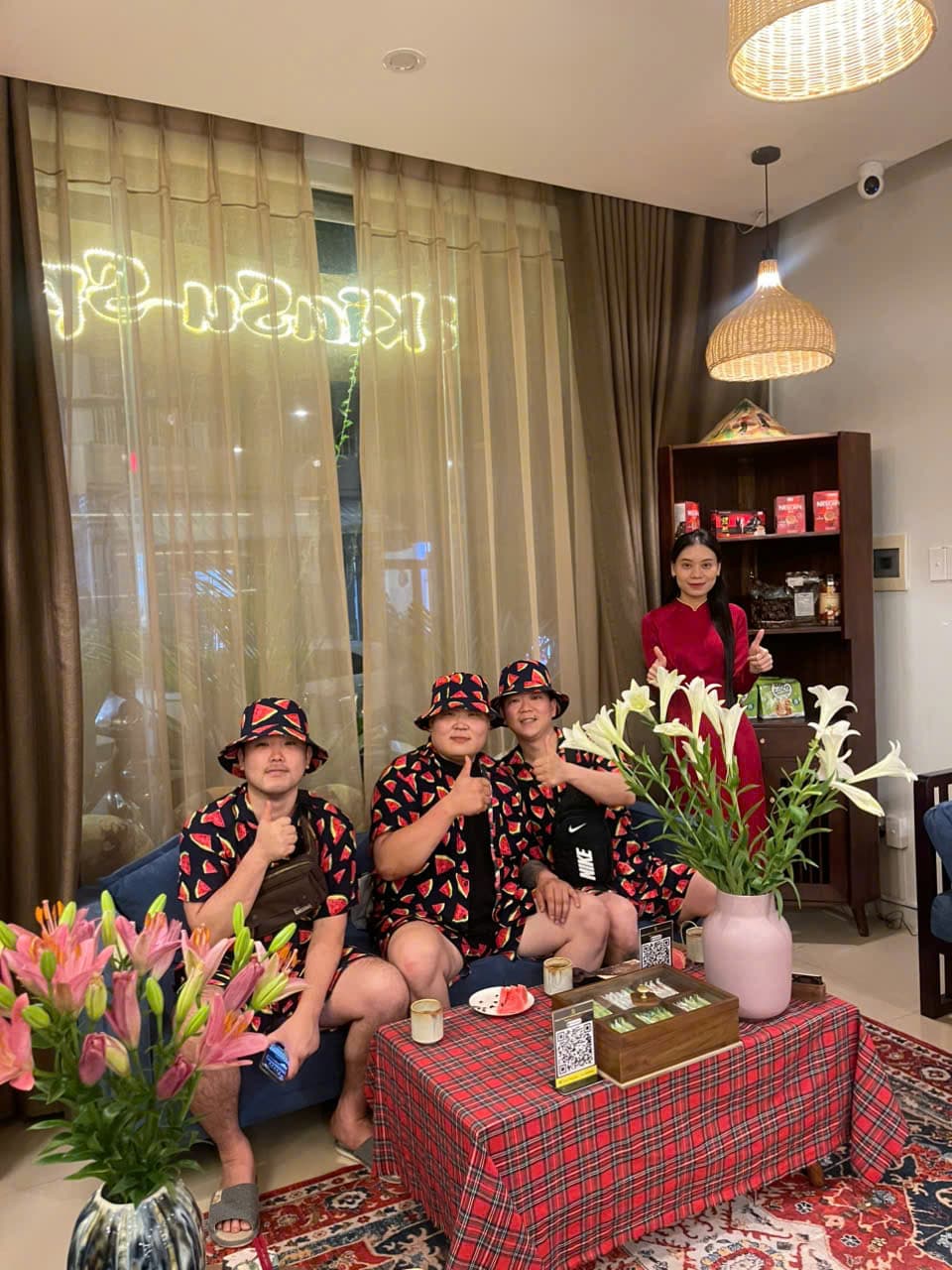 Three male guests in matching outfits giving a thumbs up at Kiasu Spa.